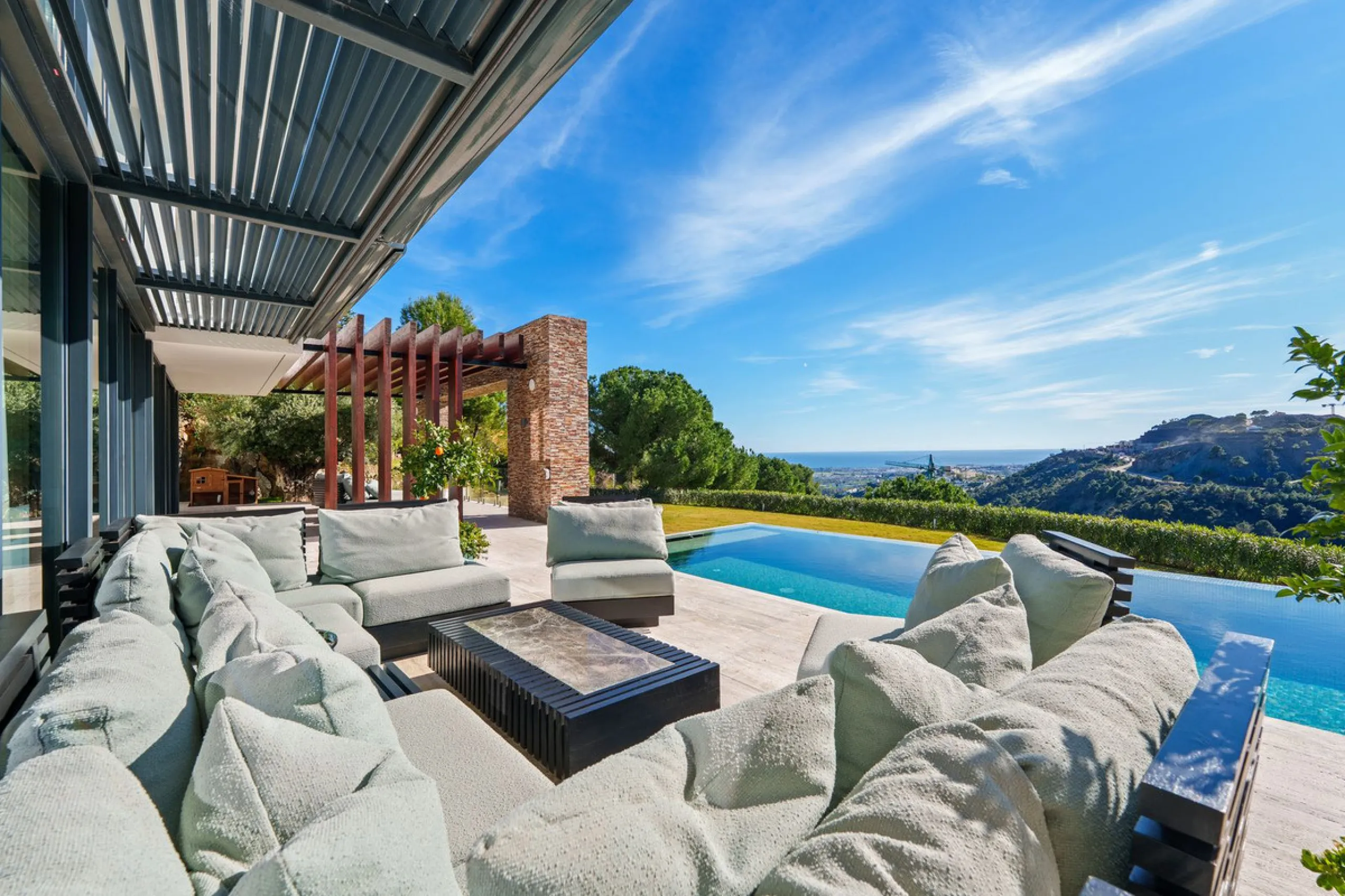 A five-bedroom villa in the urbanisation, Benahavís, offering five bathrooms plus a guest cloakroom, with a first floor dedicated to the master suite with dressing room and library alongside a guest ensuite, a ground floor arranged around formal and infor