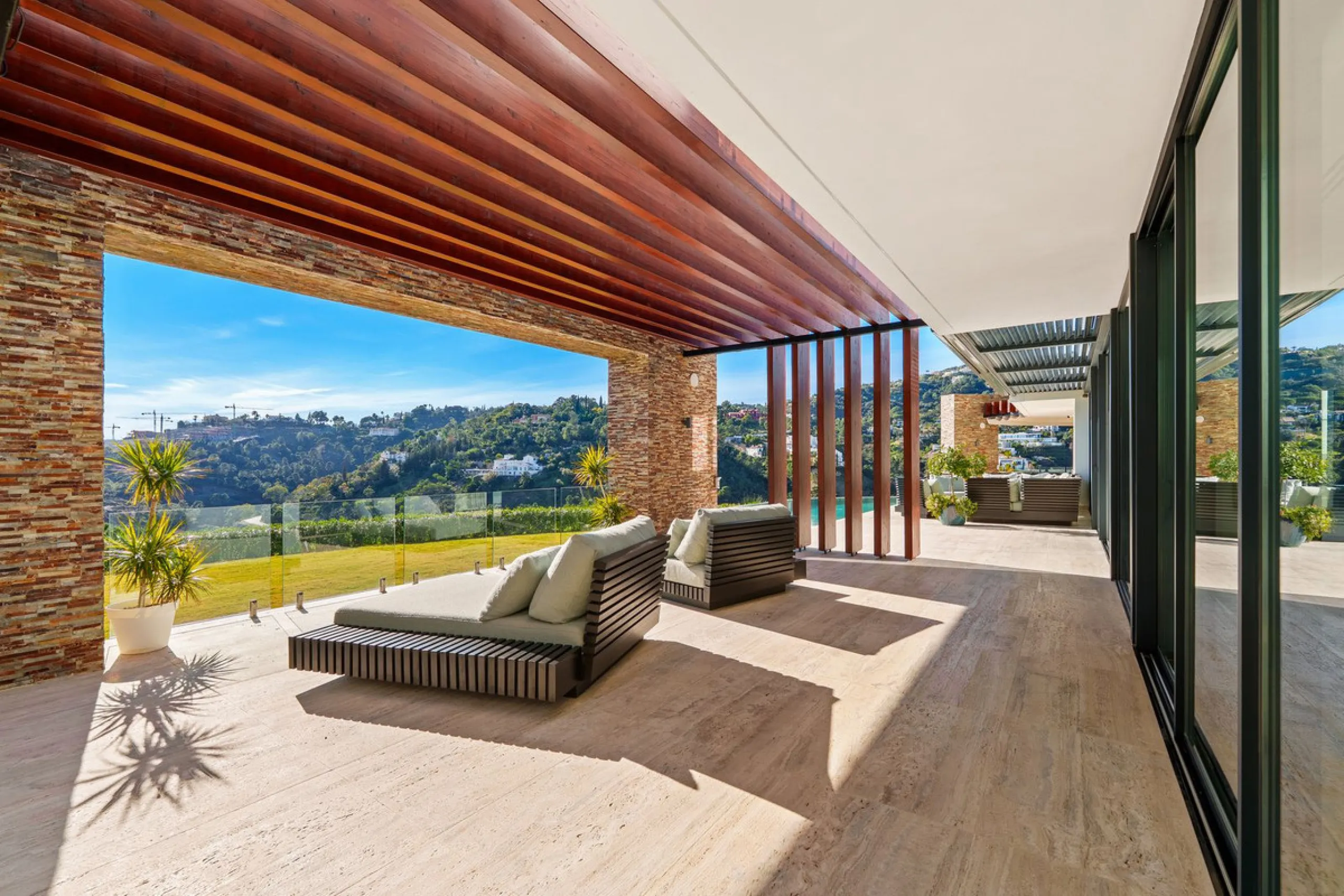 A five-bedroom villa in the urbanisation, Benahavís, offering five bathrooms plus a guest cloakroom, with a first floor dedicated to the master suite with dressing room and library alongside a guest ensuite, a ground floor arranged around formal and infor