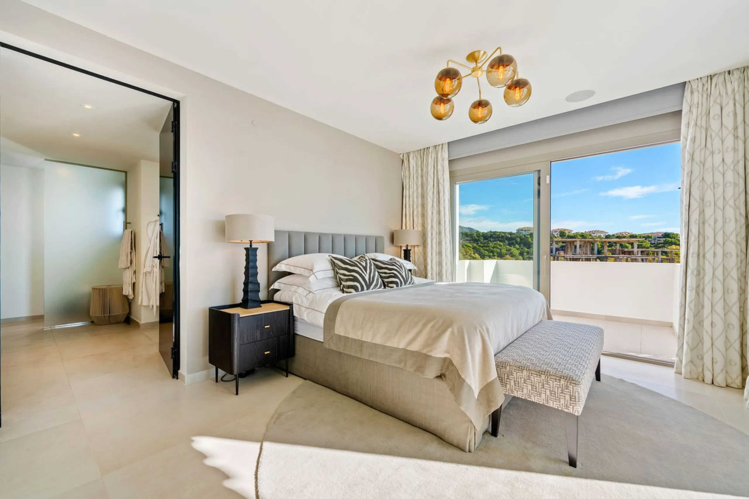 This exceptional duplex penthouse is located within an exclusive gated community in Aloha, one of the most prestigious residential developments in Nueva Andalucía. Set in an elevated position, the property enjoys panoramic open views across the surroundin