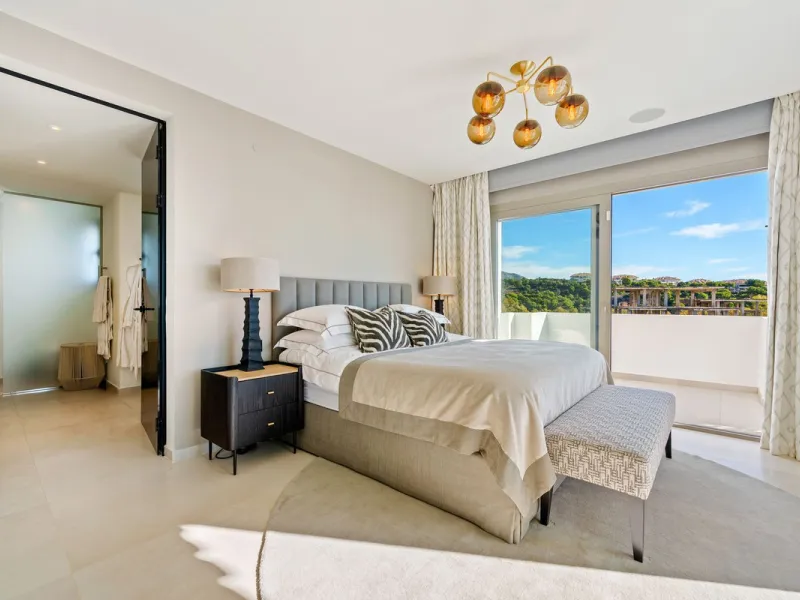 This exceptional duplex penthouse is located within an exclusive gated community in Aloha, one of the most prestigious residential developments in Nueva Andalucía. Set in an elevated position, the property enjoys panoramic open views across the surroundin