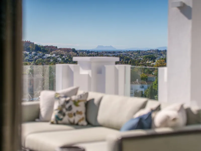 This exceptional duplex penthouse is located within an exclusive gated community in Aloha, one of the most prestigious residential developments in Nueva Andalucía. Set in an elevated position, the property enjoys panoramic open views across the surroundin