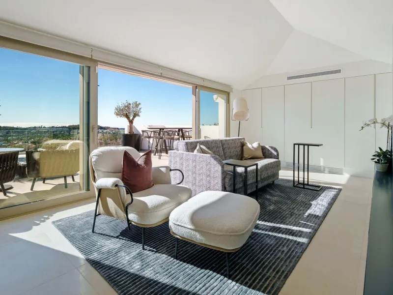 This exceptional duplex penthouse is located within an exclusive gated community in Aloha, one of the most prestigious residential developments in Nueva Andalucía. Set in an elevated position, the property enjoys panoramic open views across the surroundin
