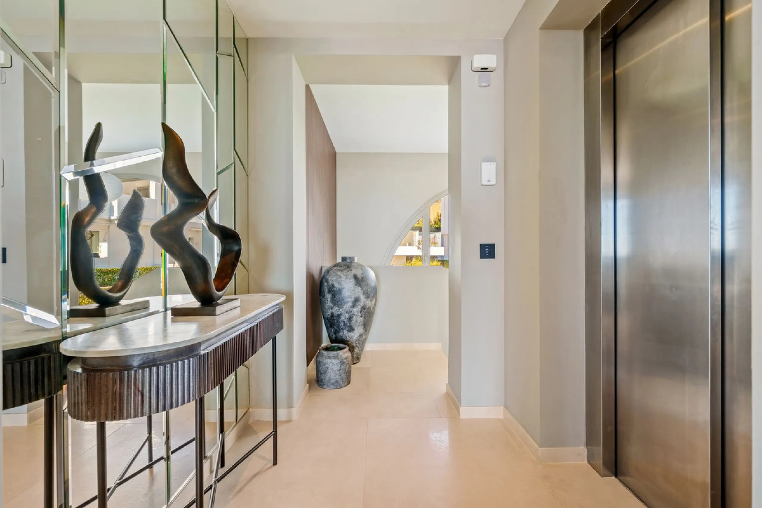 This exceptional duplex penthouse is located within an exclusive gated community in Aloha, one of the most prestigious residential developments in Nueva Andalucía. Set in an elevated position, the property enjoys panoramic open views across the surroundin