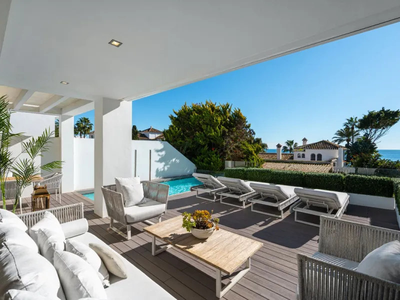 A semi-detached villa in the urbanisation, four bedrooms, four bathrooms, arranged with intent rather than habit: basement level below, an entrance floor with three en-suite bedrooms and a calm water feature setting the tone, a first floor dedicated entir