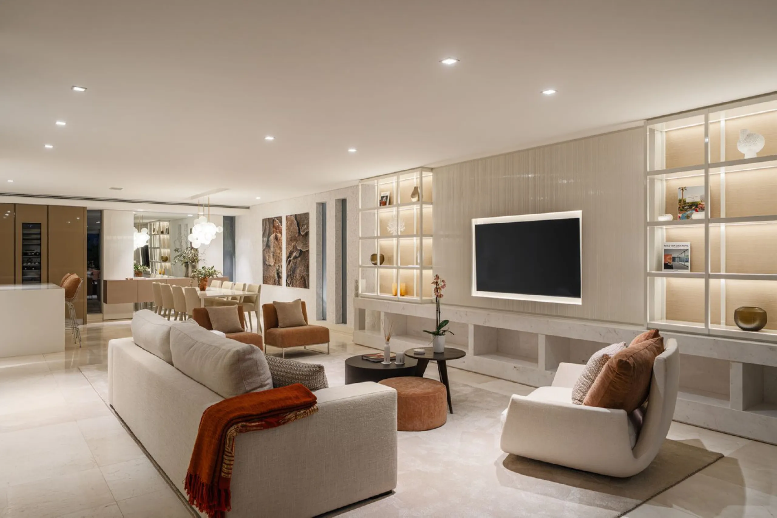 A semi-detached villa in the urbanisation, four bedrooms, four bathrooms, arranged with intent rather than habit: basement level below, an entrance floor with three en-suite bedrooms and a calm water feature setting the tone, a first floor dedicated entir