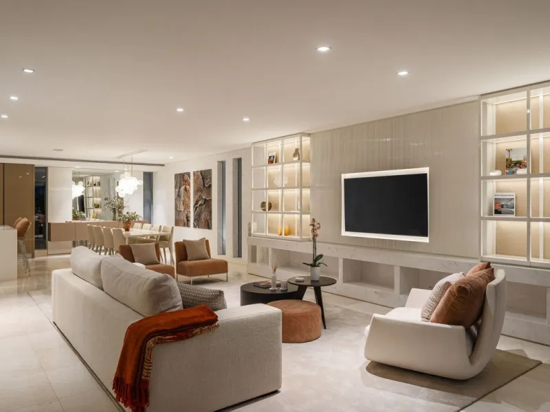 A semi-detached villa in the urbanisation, four bedrooms, four bathrooms, arranged with intent rather than habit: basement level below, an entrance floor with three en-suite bedrooms and a calm water feature setting the tone, a first floor dedicated entir