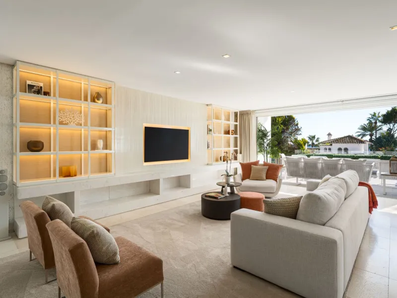 A semi-detached villa in the urbanisation, four bedrooms, four bathrooms, arranged with intent rather than habit: basement level below, an entrance floor with three en-suite bedrooms and a calm water feature setting the tone, a first floor dedicated entir