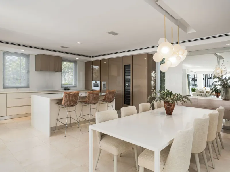 A semi-detached villa in the urbanisation, four bedrooms, four bathrooms, arranged with intent rather than habit: basement level below, an entrance floor with three en-suite bedrooms and a calm water feature setting the tone, a first floor dedicated entir