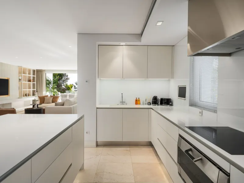 A semi-detached villa in the urbanisation, four bedrooms, four bathrooms, arranged with intent rather than habit: basement level below, an entrance floor with three en-suite bedrooms and a calm water feature setting the tone, a first floor dedicated entir