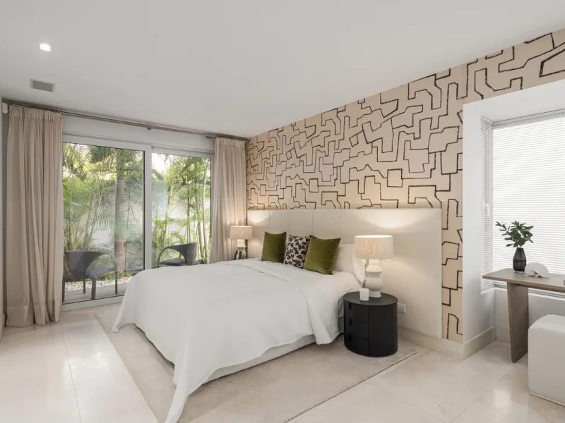A semi-detached villa in the urbanisation, four bedrooms, four bathrooms, arranged with intent rather than habit: basement level below, an entrance floor with three en-suite bedrooms and a calm water feature setting the tone, a first floor dedicated entir