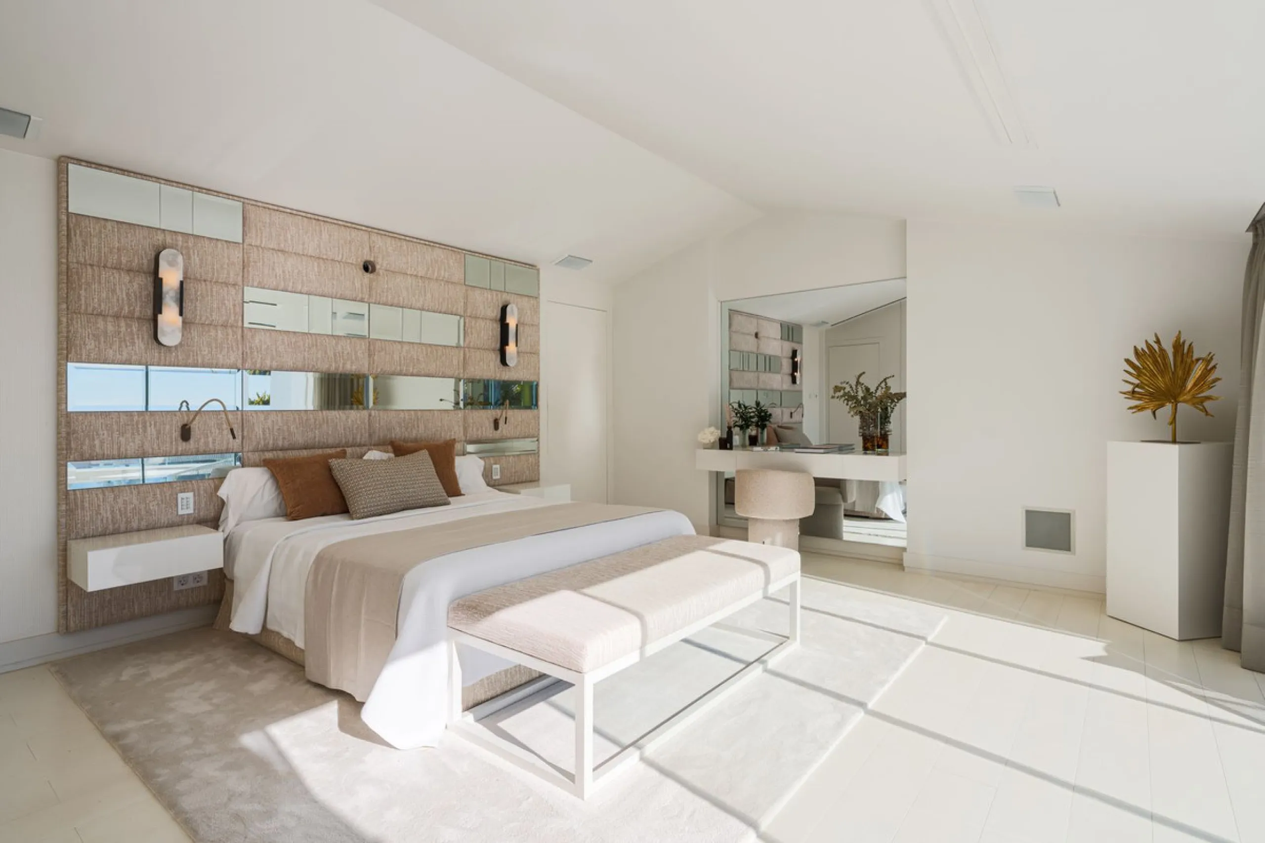 A semi-detached villa in the urbanisation, four bedrooms, four bathrooms, arranged with intent rather than habit: basement level below, an entrance floor with three en-suite bedrooms and a calm water feature setting the tone, a first floor dedicated entir