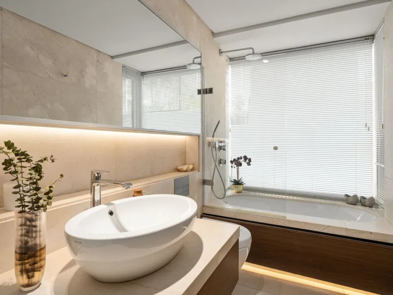 A semi-detached villa in the urbanisation, four bedrooms, four bathrooms, arranged with intent rather than habit: basement level below, an entrance floor with three en-suite bedrooms and a calm water feature setting the tone, a first floor dedicated entir