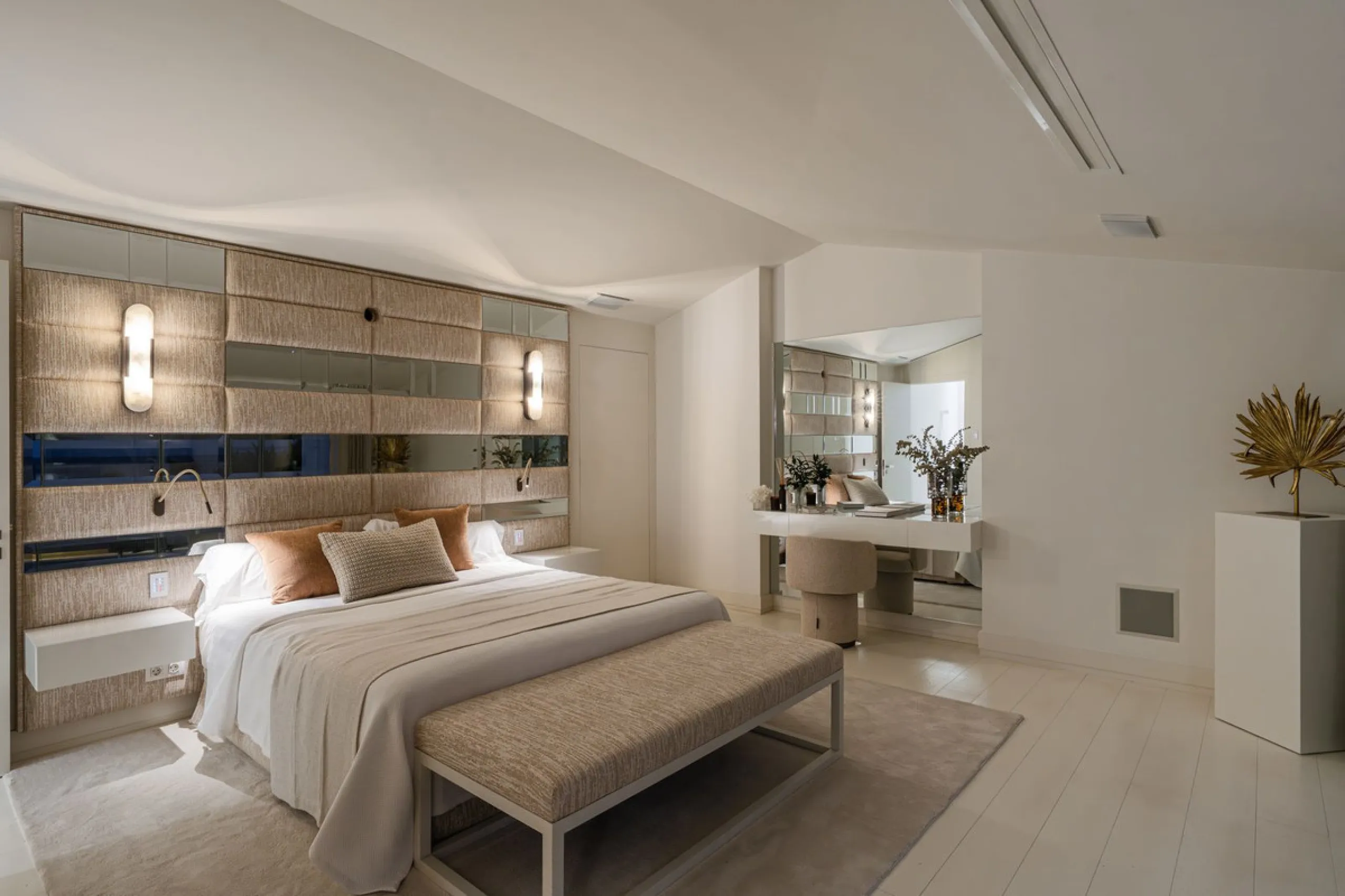 A semi-detached villa in the urbanisation, four bedrooms, four bathrooms, arranged with intent rather than habit: basement level below, an entrance floor with three en-suite bedrooms and a calm water feature setting the tone, a first floor dedicated entir