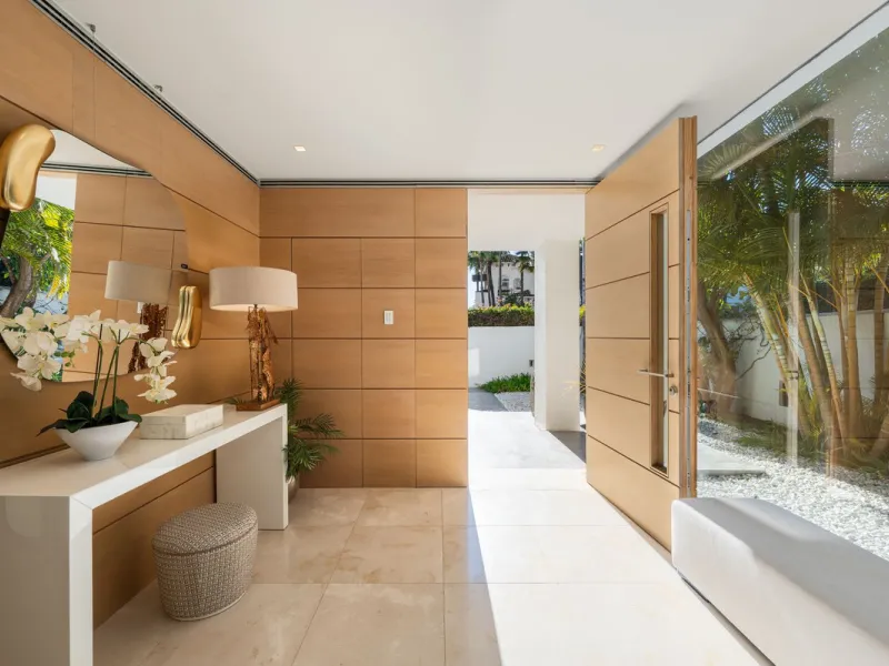 A semi-detached villa in the urbanisation, four bedrooms, four bathrooms, arranged with intent rather than habit: basement level below, an entrance floor with three en-suite bedrooms and a calm water feature setting the tone, a first floor dedicated entir