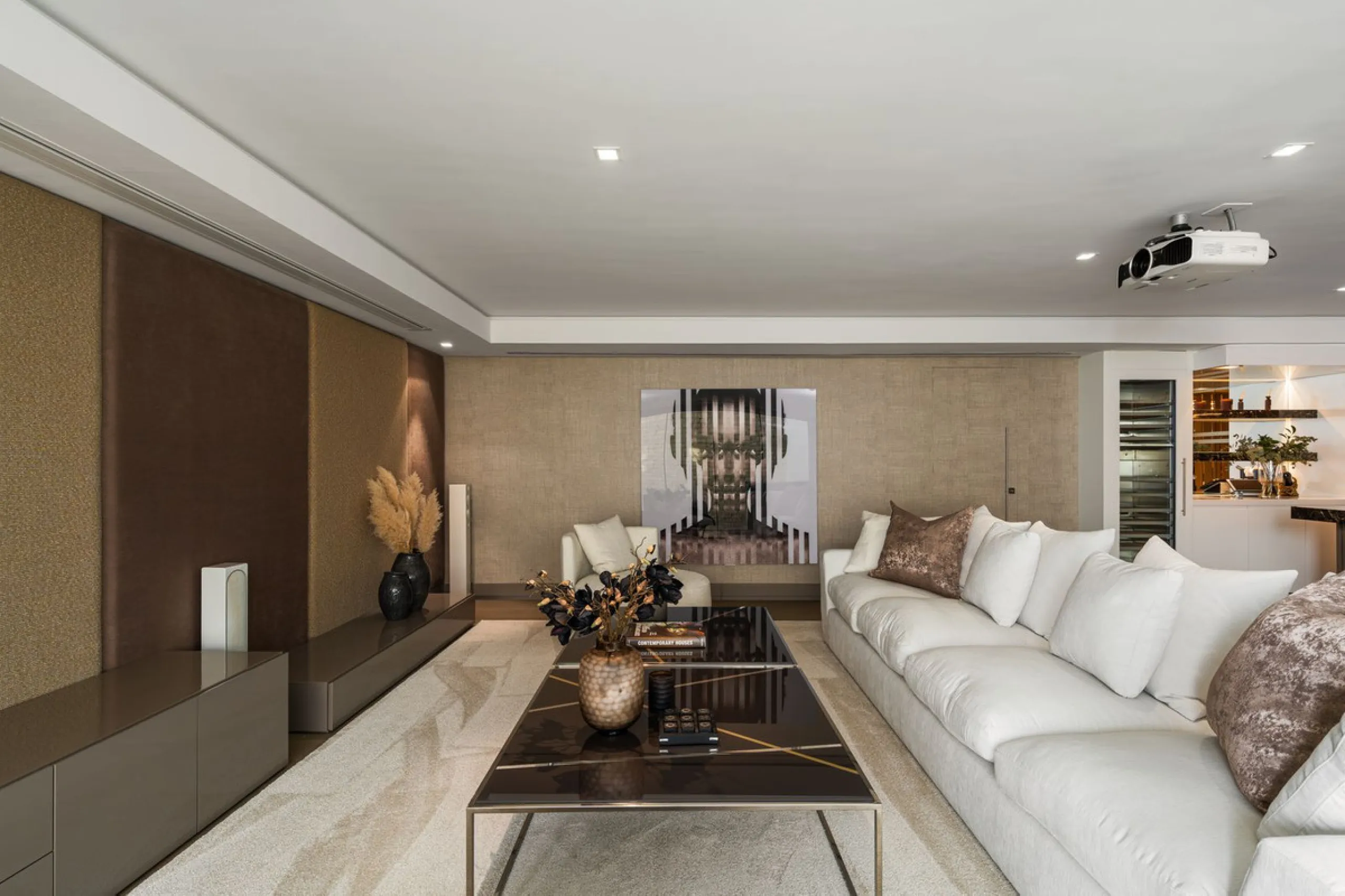 A semi-detached villa in the urbanisation, four bedrooms, four bathrooms, arranged with intent rather than habit: basement level below, an entrance floor with three en-suite bedrooms and a calm water feature setting the tone, a first floor dedicated entir