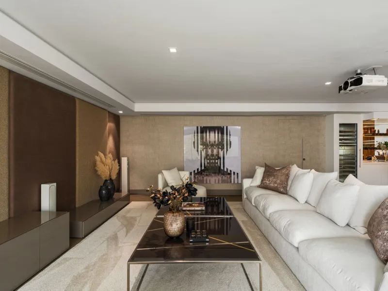 A semi-detached villa in the urbanisation, four bedrooms, four bathrooms, arranged with intent rather than habit: basement level below, an entrance floor with three en-suite bedrooms and a calm water feature setting the tone, a first floor dedicated entir