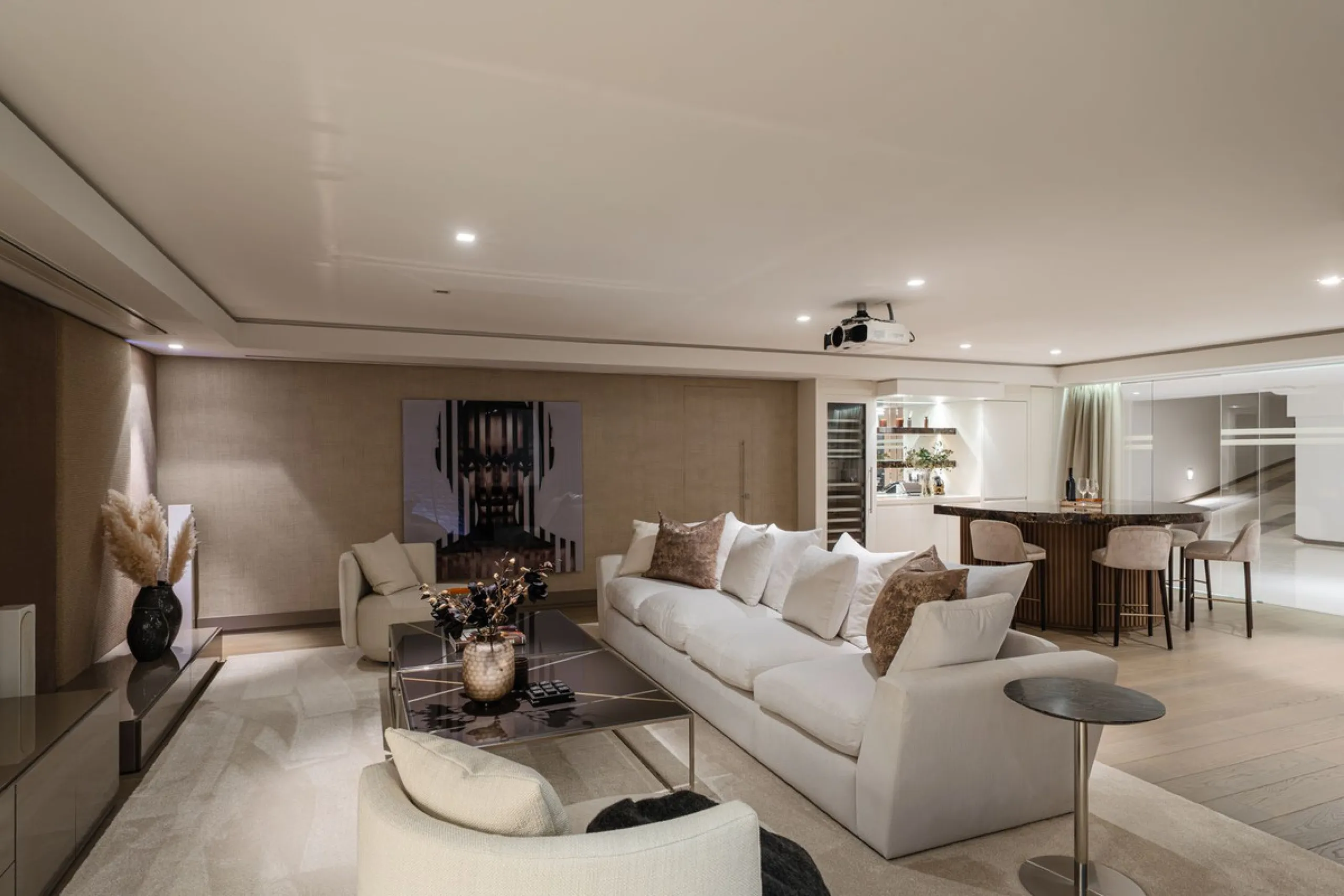 A semi-detached villa in the urbanisation, four bedrooms, four bathrooms, arranged with intent rather than habit: basement level below, an entrance floor with three en-suite bedrooms and a calm water feature setting the tone, a first floor dedicated entir