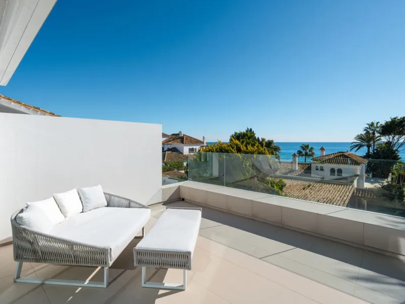 A semi-detached villa in the urbanisation, four bedrooms, four bathrooms, arranged with intent rather than habit: basement level below, an entrance floor with three en-suite bedrooms and a calm water feature setting the tone, a first floor dedicated entir