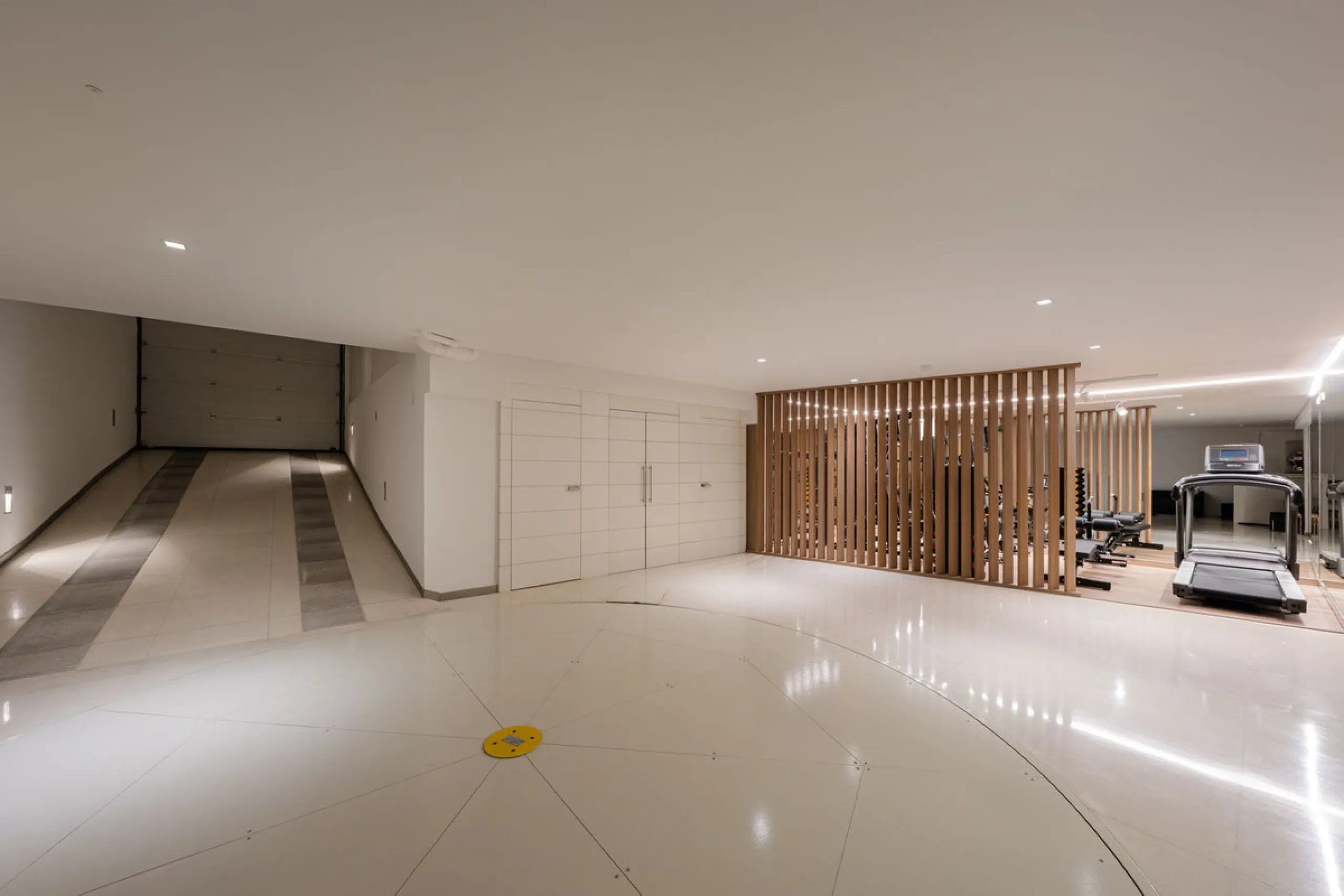 A semi-detached villa in the urbanisation, four bedrooms, four bathrooms, arranged with intent rather than habit: basement level below, an entrance floor with three en-suite bedrooms and a calm water feature setting the tone, a first floor dedicated entir