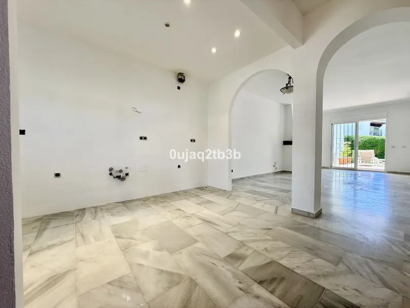 Exclusive Ground Floor Apartment with Garden in Nueva Andalucía, Steps from Puerto Banús