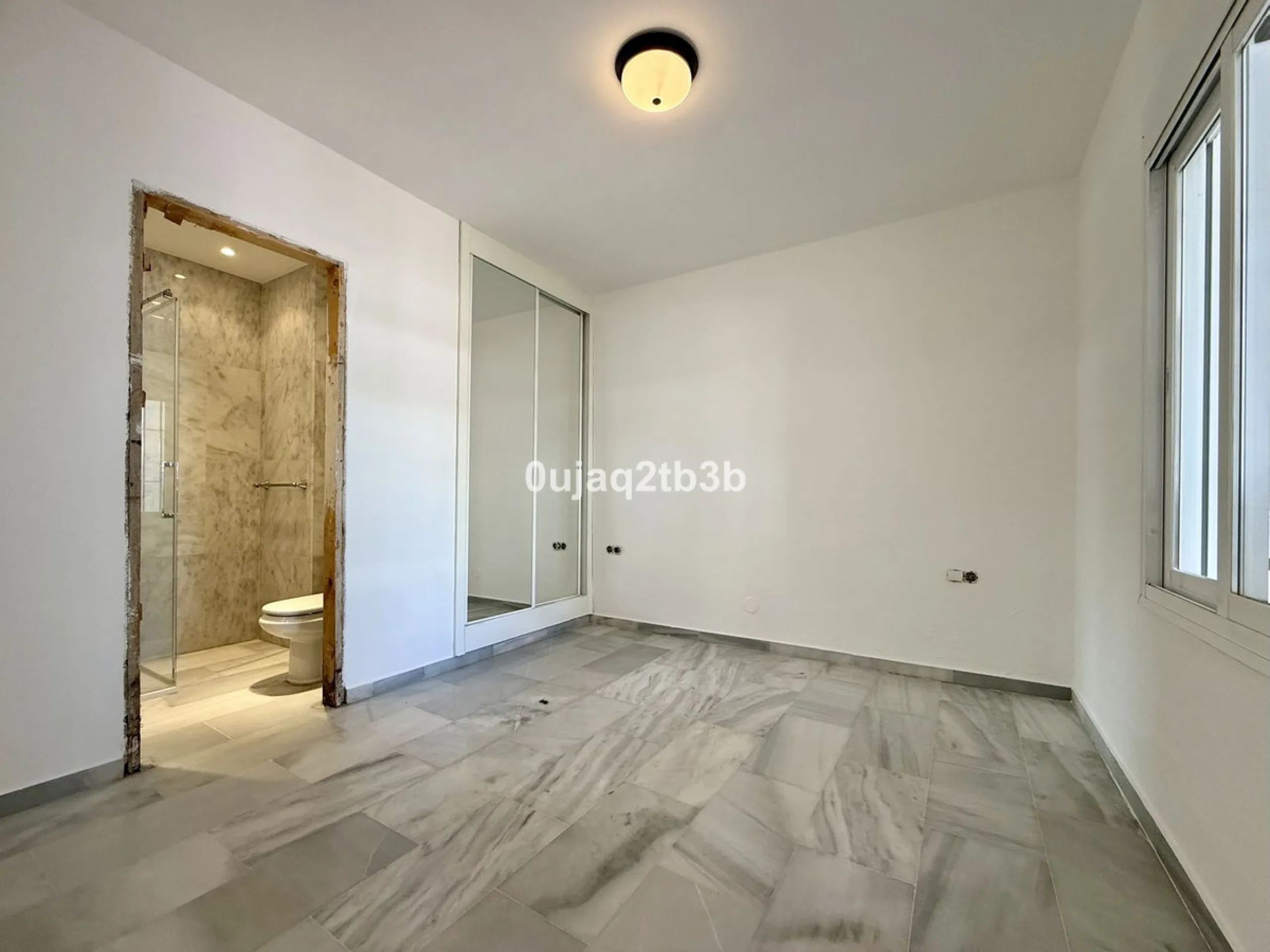 Exclusive Ground Floor Apartment with Garden in Nueva Andalucía, Steps from Puerto Banús