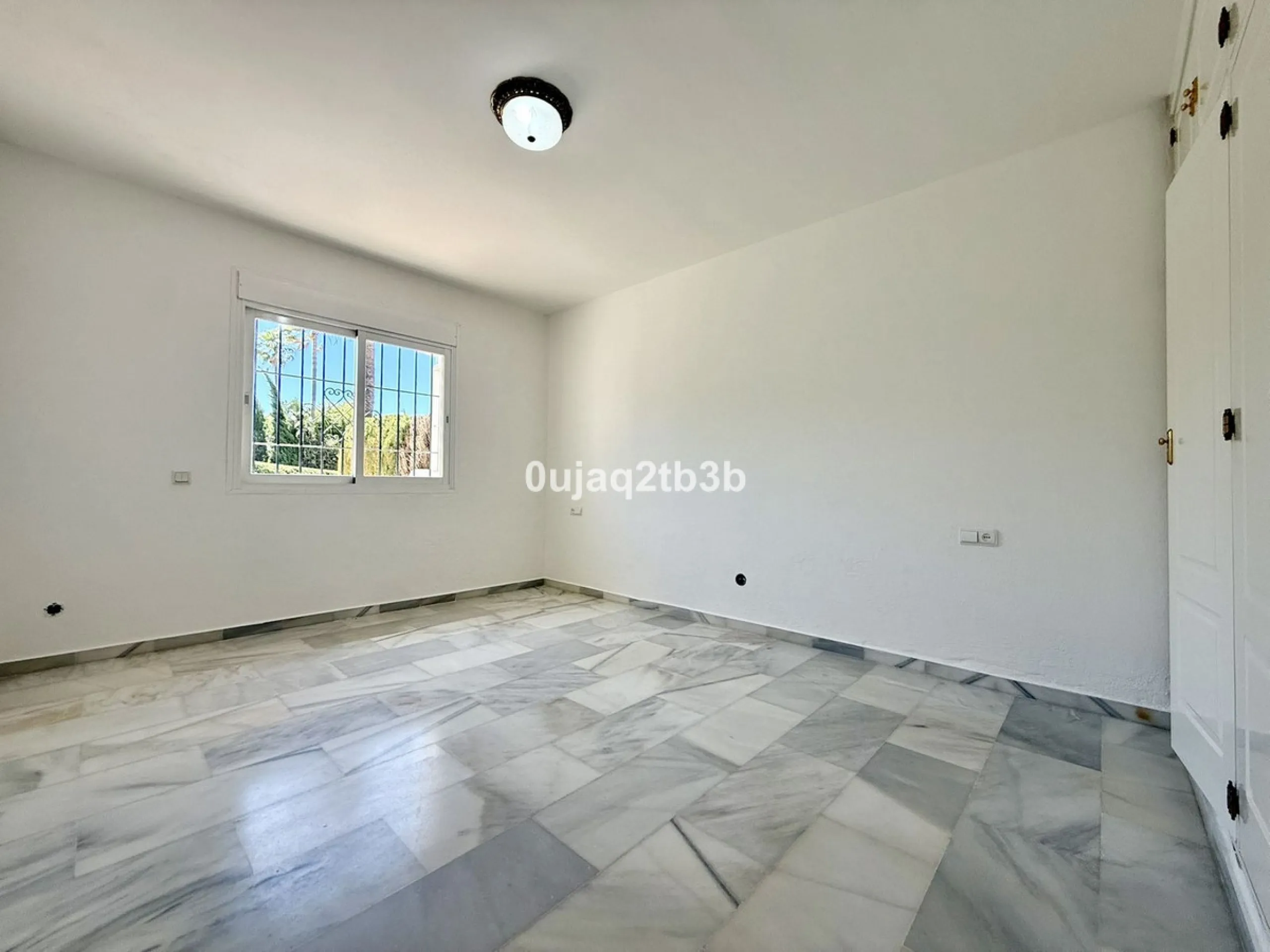 Exclusive Ground Floor Apartment with Garden in Nueva Andalucía, Steps from Puerto Banús