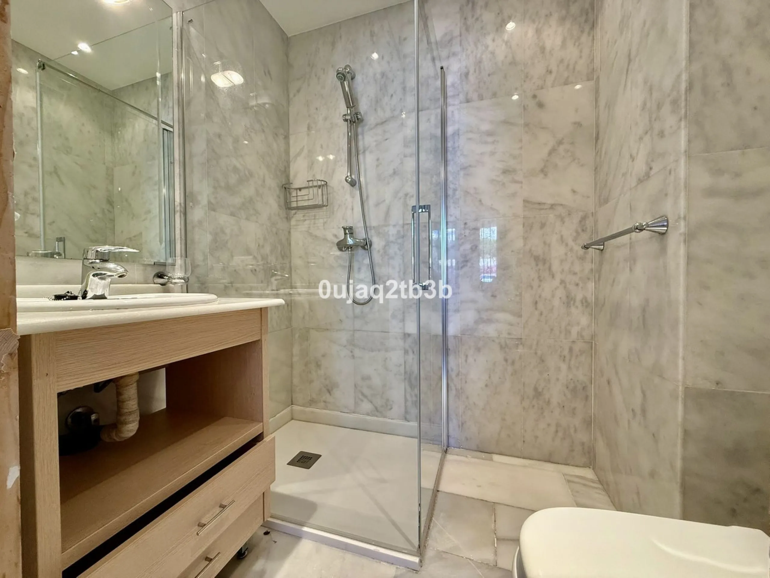 Exclusive Ground Floor Apartment with Garden in Nueva Andalucía, Steps from Puerto Banús