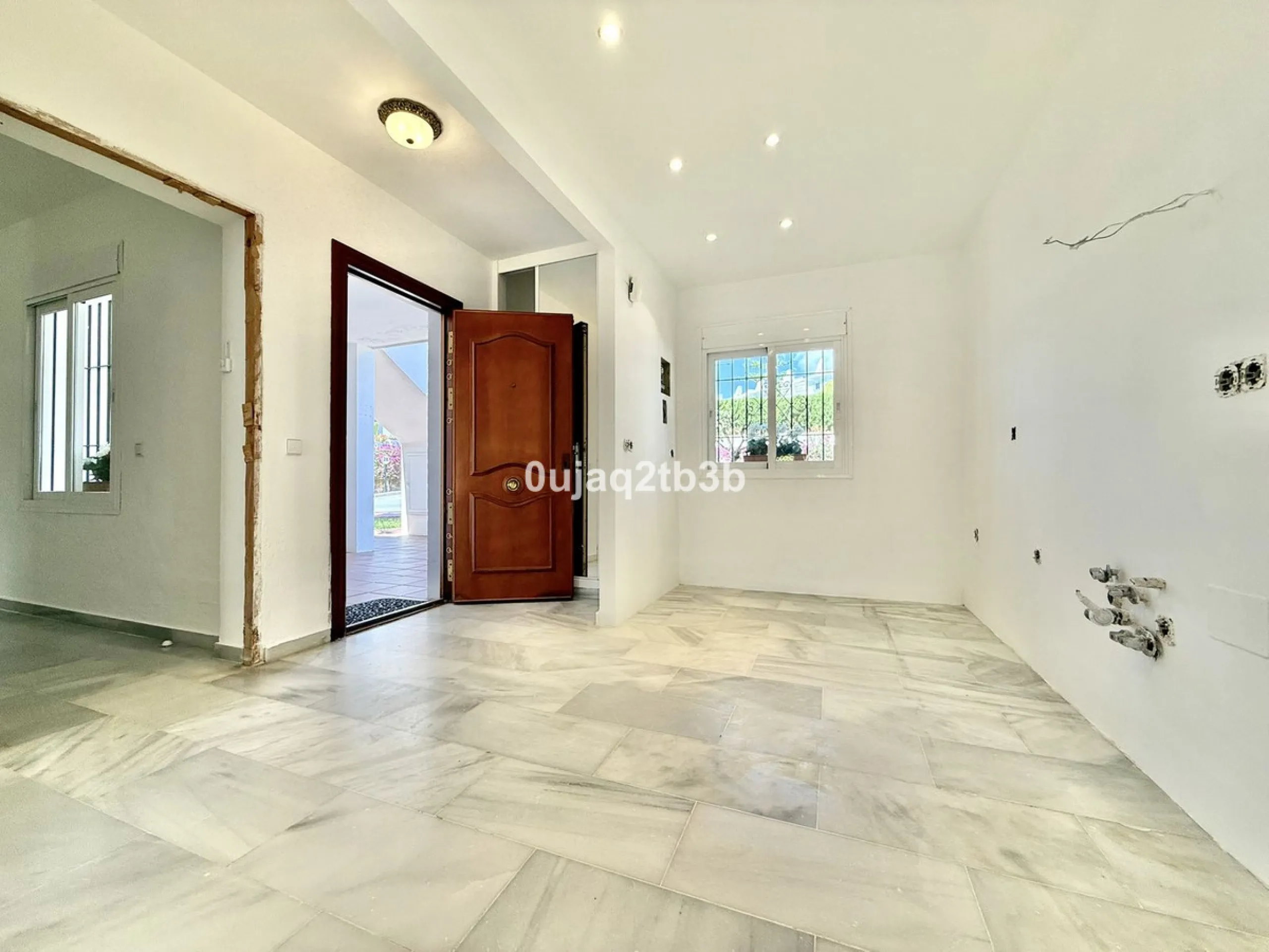 Exclusive Ground Floor Apartment with Garden in Nueva Andalucía, Steps from Puerto Banús