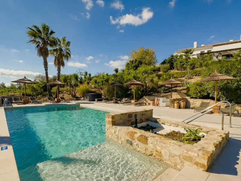 This exceptional Andalusian estate, located in the charming village of Villanueva de la Concepción, offers a rare combination of space, privacy, and breathtaking surroundings. The main residence includes 11 beautifully renovated bedrooms, comfortably acco