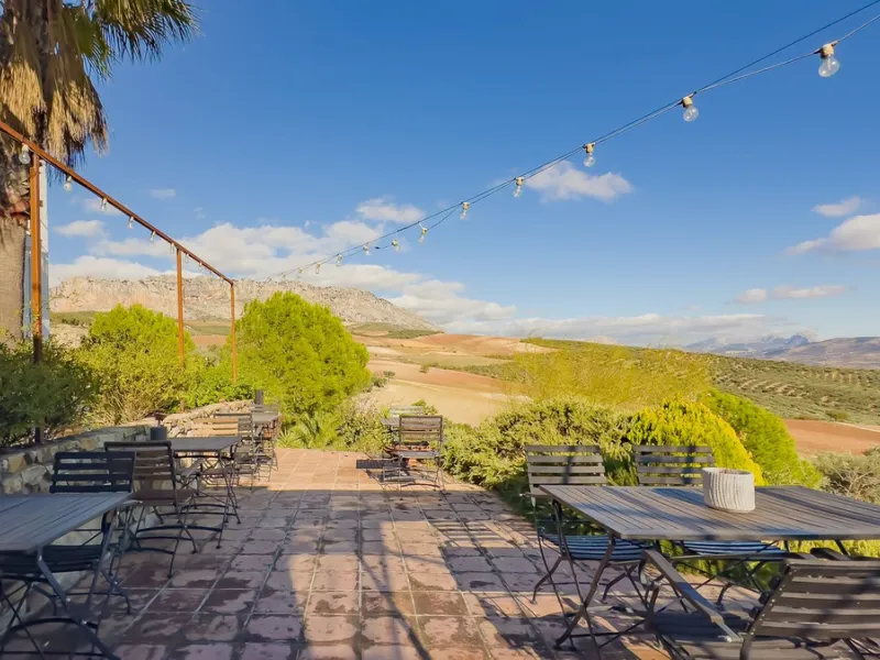 This exceptional Andalusian estate, located in the charming village of Villanueva de la Concepción, offers a rare combination of space, privacy, and breathtaking surroundings. The main residence includes 11 beautifully renovated bedrooms, comfortably acco