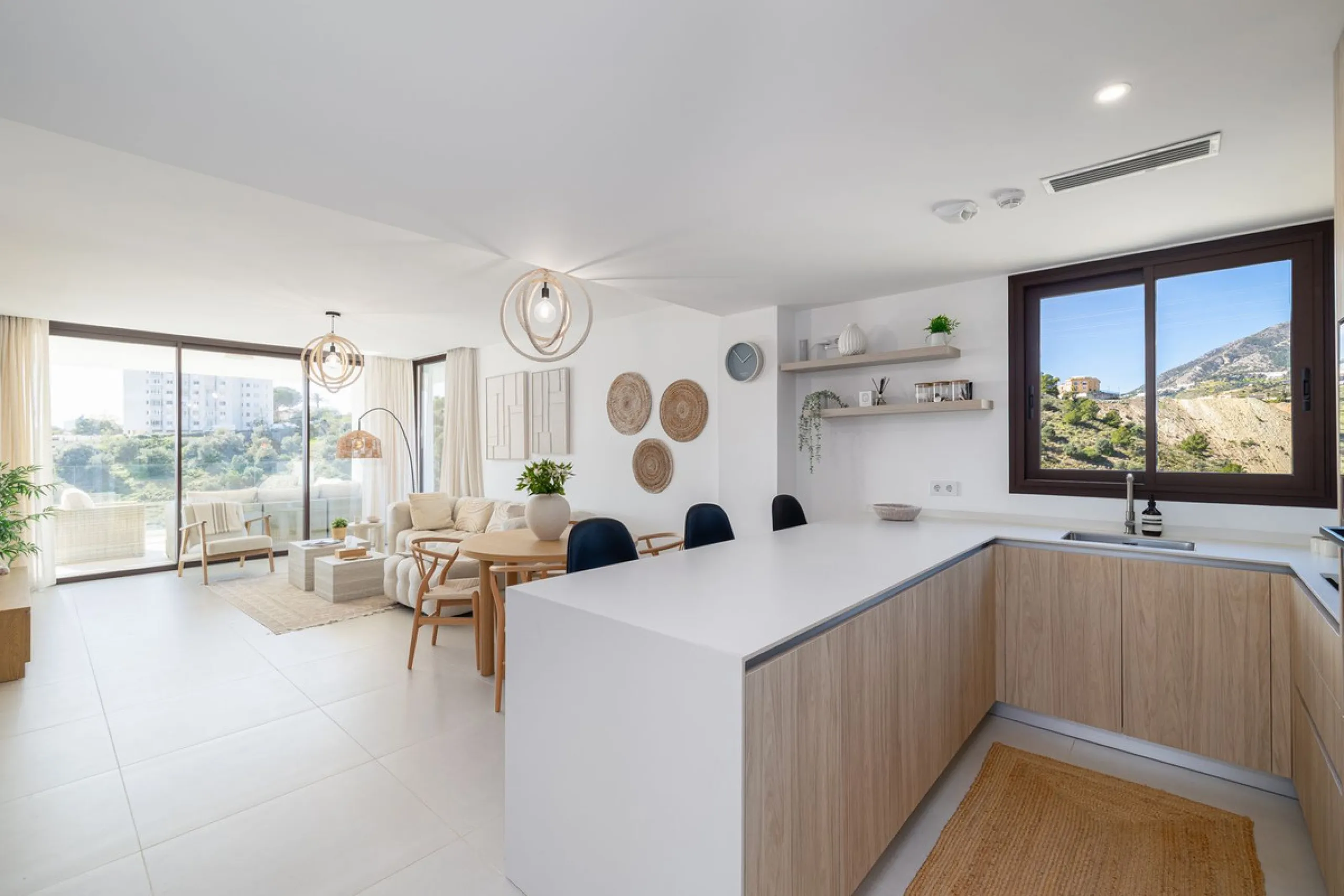 Finding the perfect balance between coastal serenity and modern luxury is effortless in this stunning corner residence, located in the highly sought-after lower enclave of El Higuerón, Fuengirola. This exceptionally spacious and luminous home is designed 