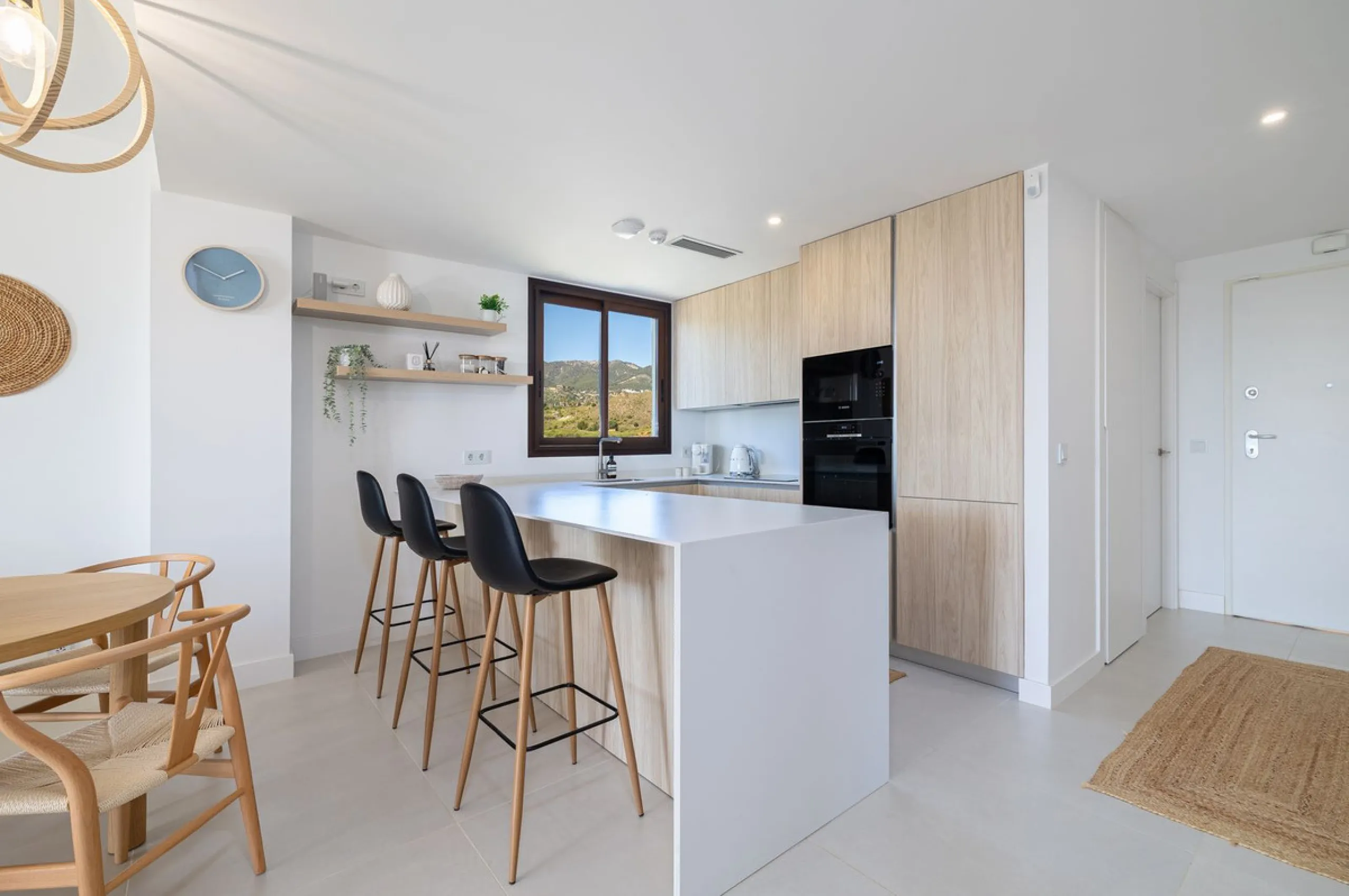Finding the perfect balance between coastal serenity and modern luxury is effortless in this stunning corner residence, located in the highly sought-after lower enclave of El Higuerón, Fuengirola. This exceptionally spacious and luminous home is designed 