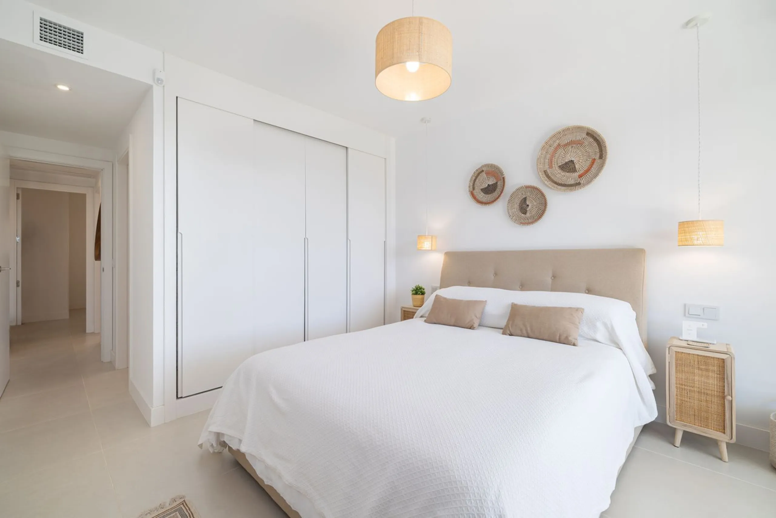 Finding the perfect balance between coastal serenity and modern luxury is effortless in this stunning corner residence, located in the highly sought-after lower enclave of El Higuerón, Fuengirola. This exceptionally spacious and luminous home is designed 