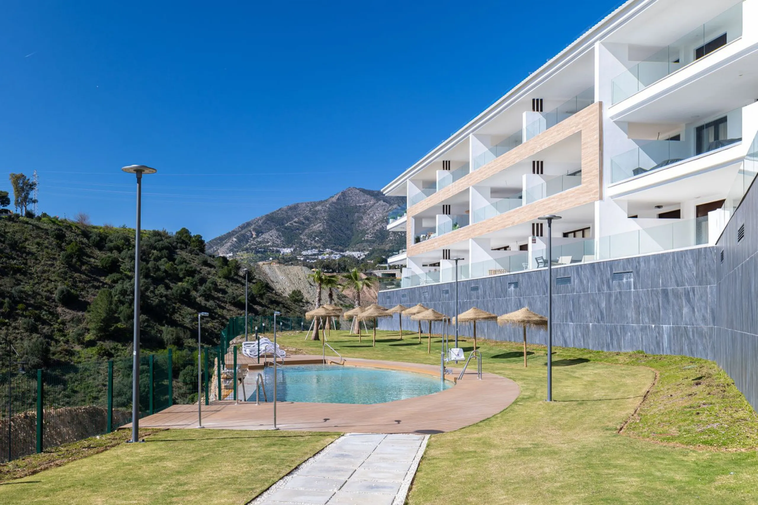 Finding the perfect balance between coastal serenity and modern luxury is effortless in this stunning corner residence, located in the highly sought-after lower enclave of El Higuerón, Fuengirola. This exceptionally spacious and luminous home is designed 