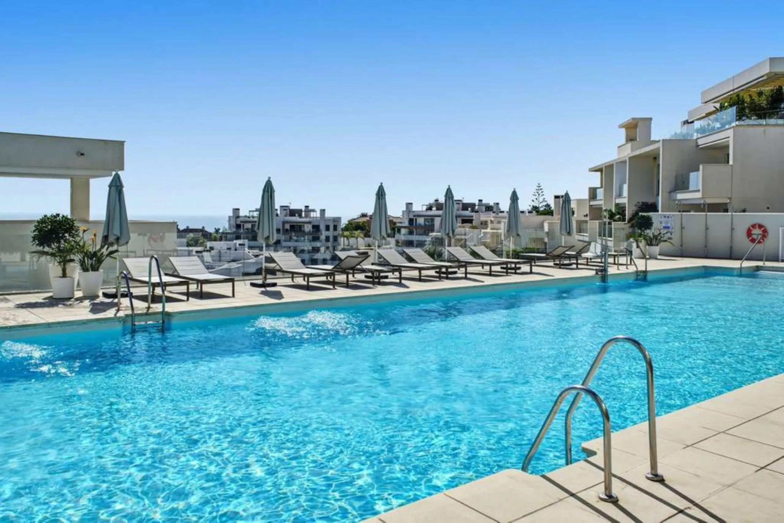Set within the dynamic and increasingly sought-after residential quarter of Las Mesas in Estepona, this elegant elevated ground-floor apartment represents a rare convergence of urban accessibility, privacy, and long-term investment appeal. Positioned just