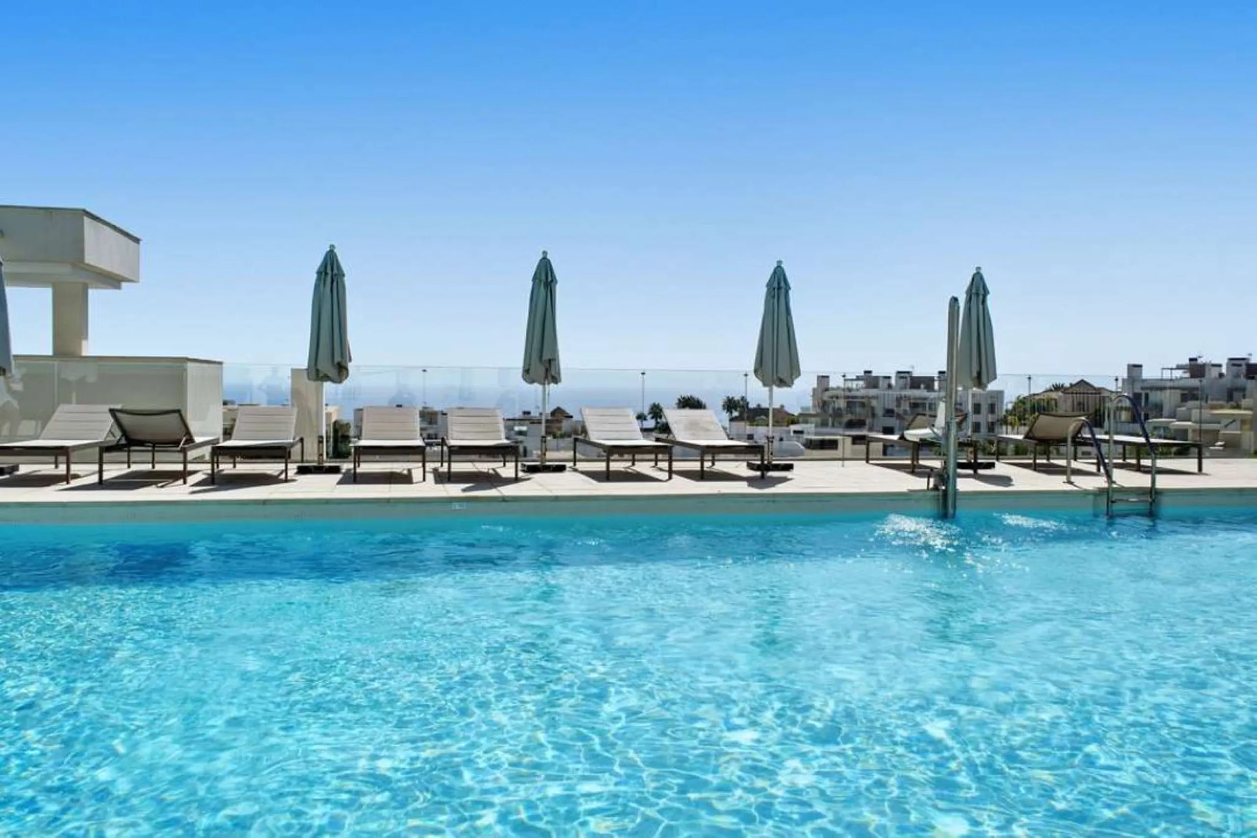 Set within the dynamic and increasingly sought-after residential quarter of Las Mesas in Estepona, this elegant elevated ground-floor apartment represents a rare convergence of urban accessibility, privacy, and long-term investment appeal. Positioned just