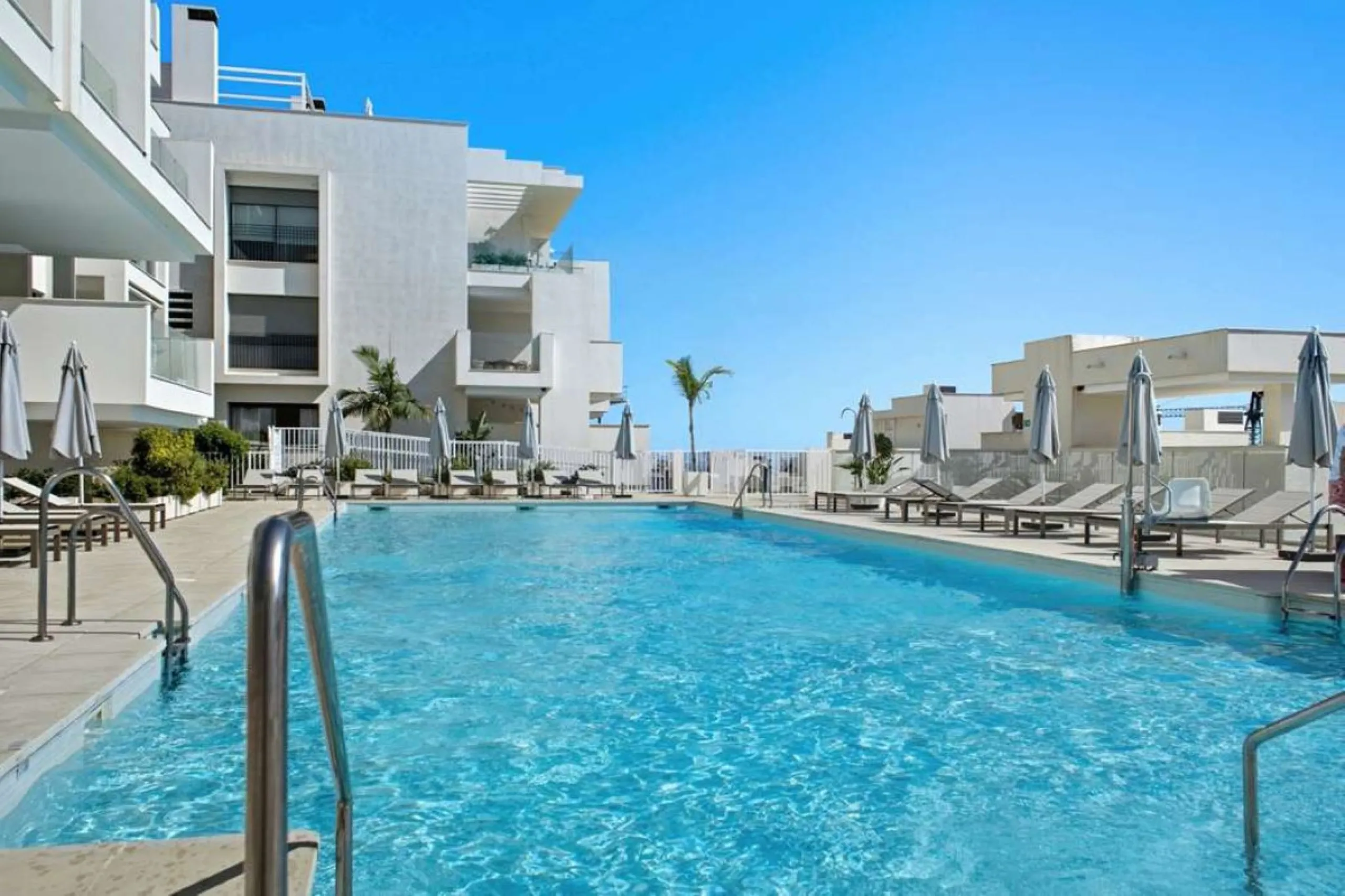 Set within the dynamic and increasingly sought-after residential quarter of Las Mesas in Estepona, this elegant elevated ground-floor apartment represents a rare convergence of urban accessibility, privacy, and long-term investment appeal. Positioned just