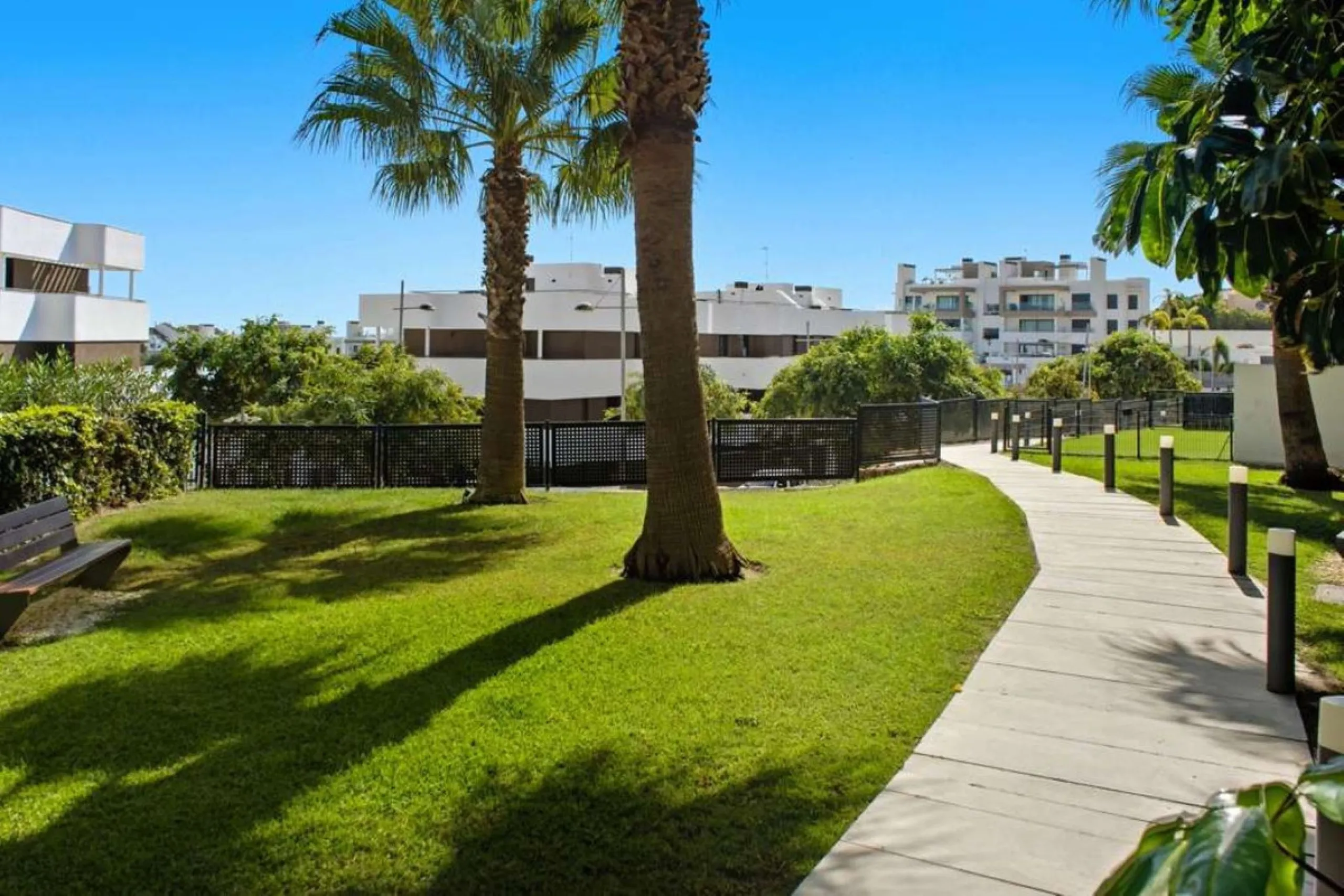 Set within the dynamic and increasingly sought-after residential quarter of Las Mesas in Estepona, this elegant elevated ground-floor apartment represents a rare convergence of urban accessibility, privacy, and long-term investment appeal. Positioned just