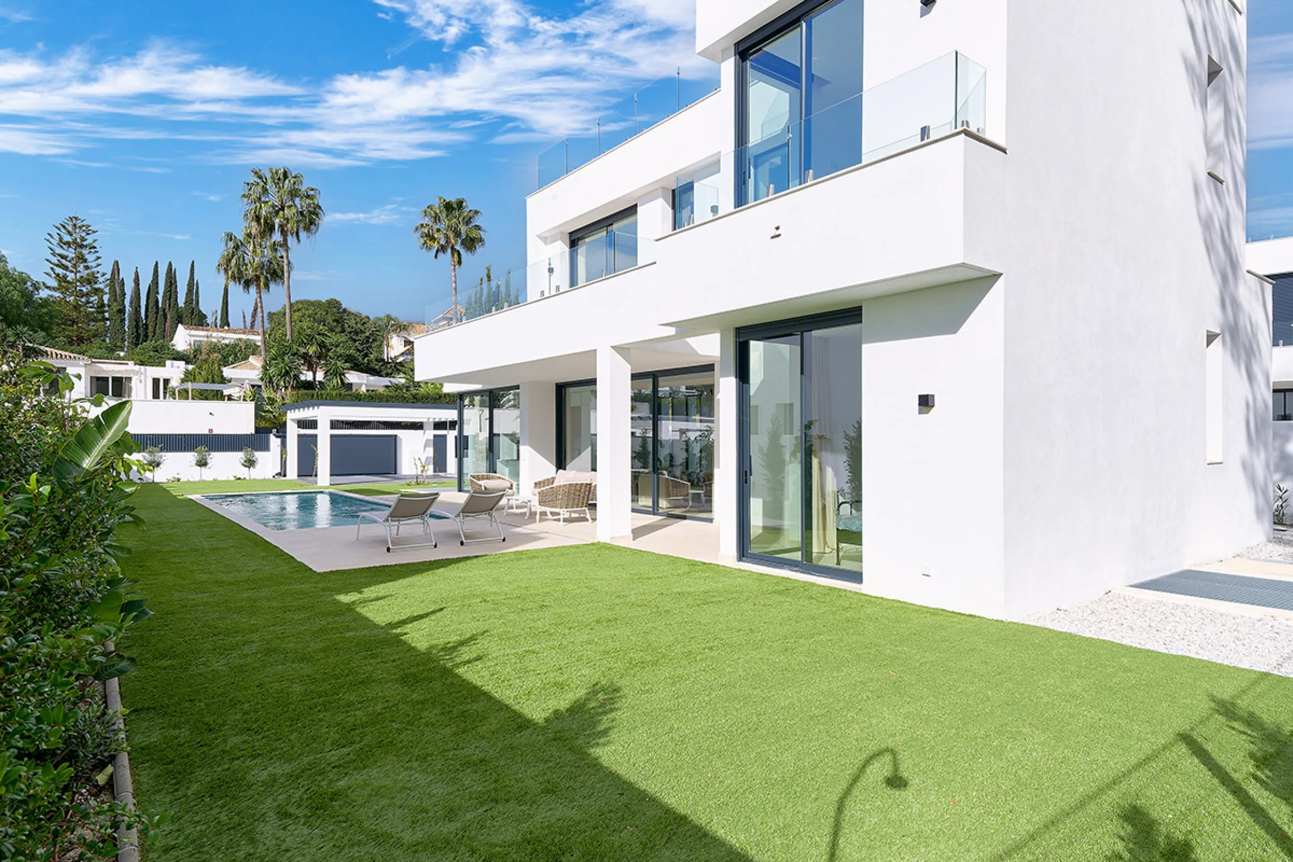 Located in the established residential area of Monte Biarritz, these two contemporary neighbouring villas offer modern Mediterranean living in a quiet yet highly connected setting between Marbella and Estepona. Designed with clean architectural lines and 