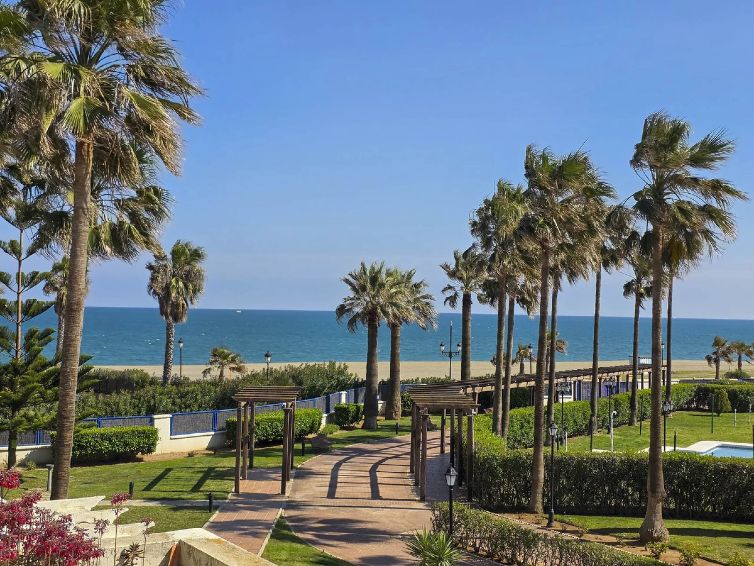 2-bedroom beachfront apartment with terrace, sea views, gardens, and pool, in the best urbanization of Sabinillas, in an unbeatable location within walking distance of all amenities.
