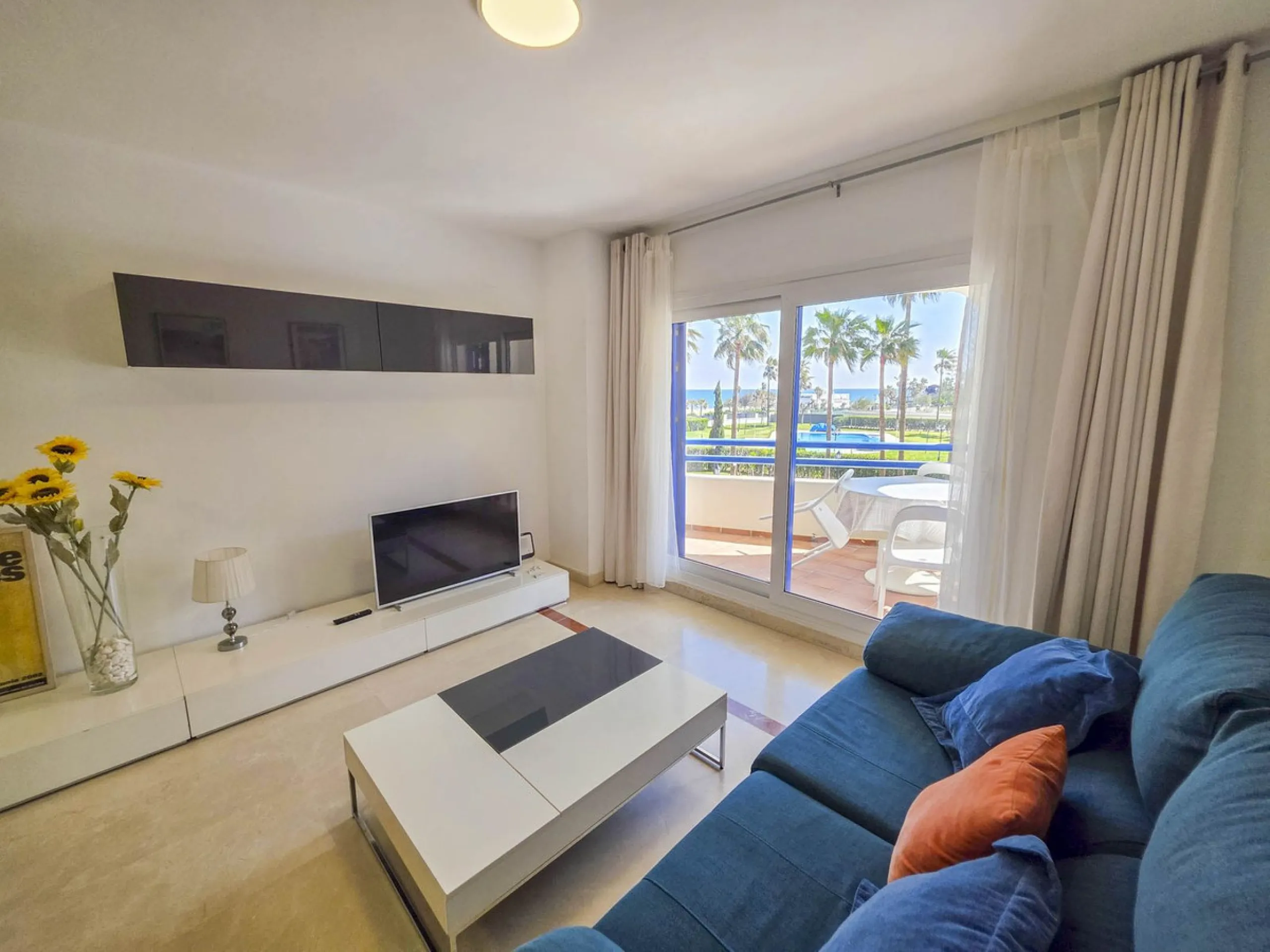 2-bedroom beachfront apartment with terrace, sea views, gardens, and pool, in the best urbanization of Sabinillas, in an unbeatable location within walking distance of all amenities.