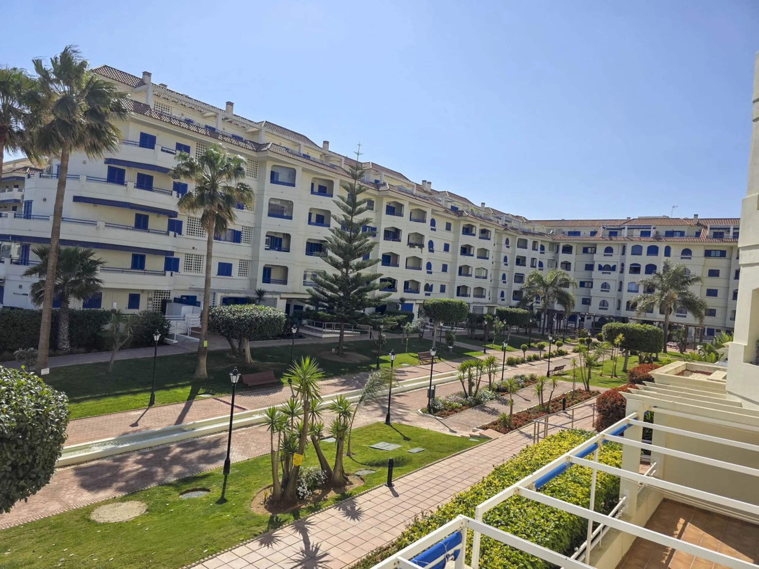 2-bedroom beachfront apartment with terrace, sea views, gardens, and pool, in the best urbanization of Sabinillas, in an unbeatable location within walking distance of all amenities.