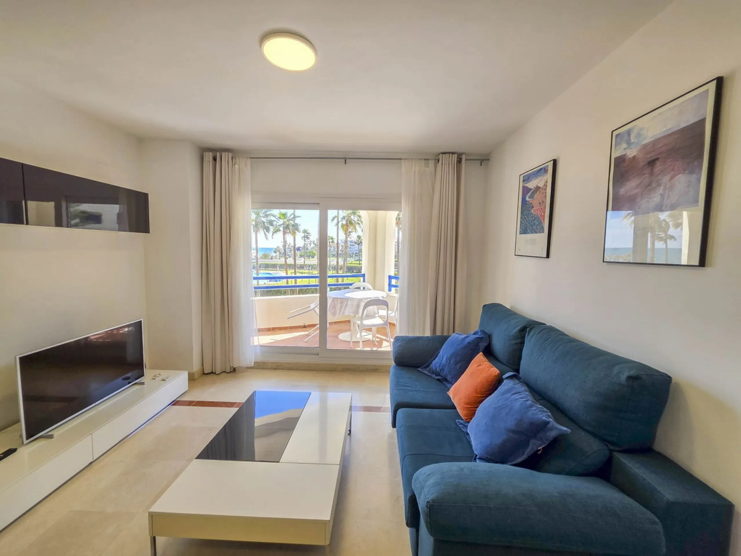 2-bedroom beachfront apartment with terrace, sea views, gardens, and pool, in the best urbanization of Sabinillas, in an unbeatable location within walking distance of all amenities.