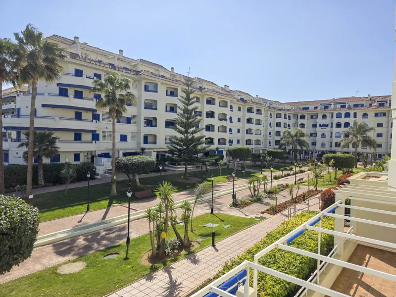 2-bedroom beachfront apartment with terrace, sea views, gardens, and pool, in the best urbanization of Sabinillas, in an unbeatable location within walking distance of all amenities.