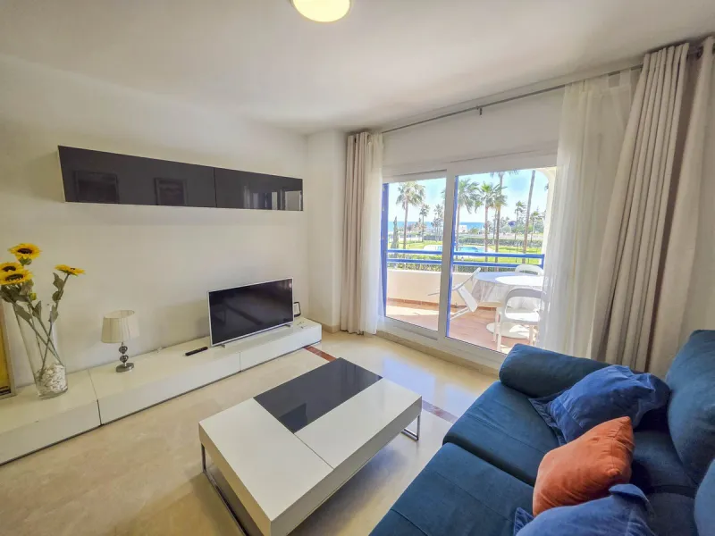 2-bedroom beachfront apartment with terrace, sea views, gardens, and pool, in the best urbanization of Sabinillas, in an unbeatable location within walking distance of all amenities.