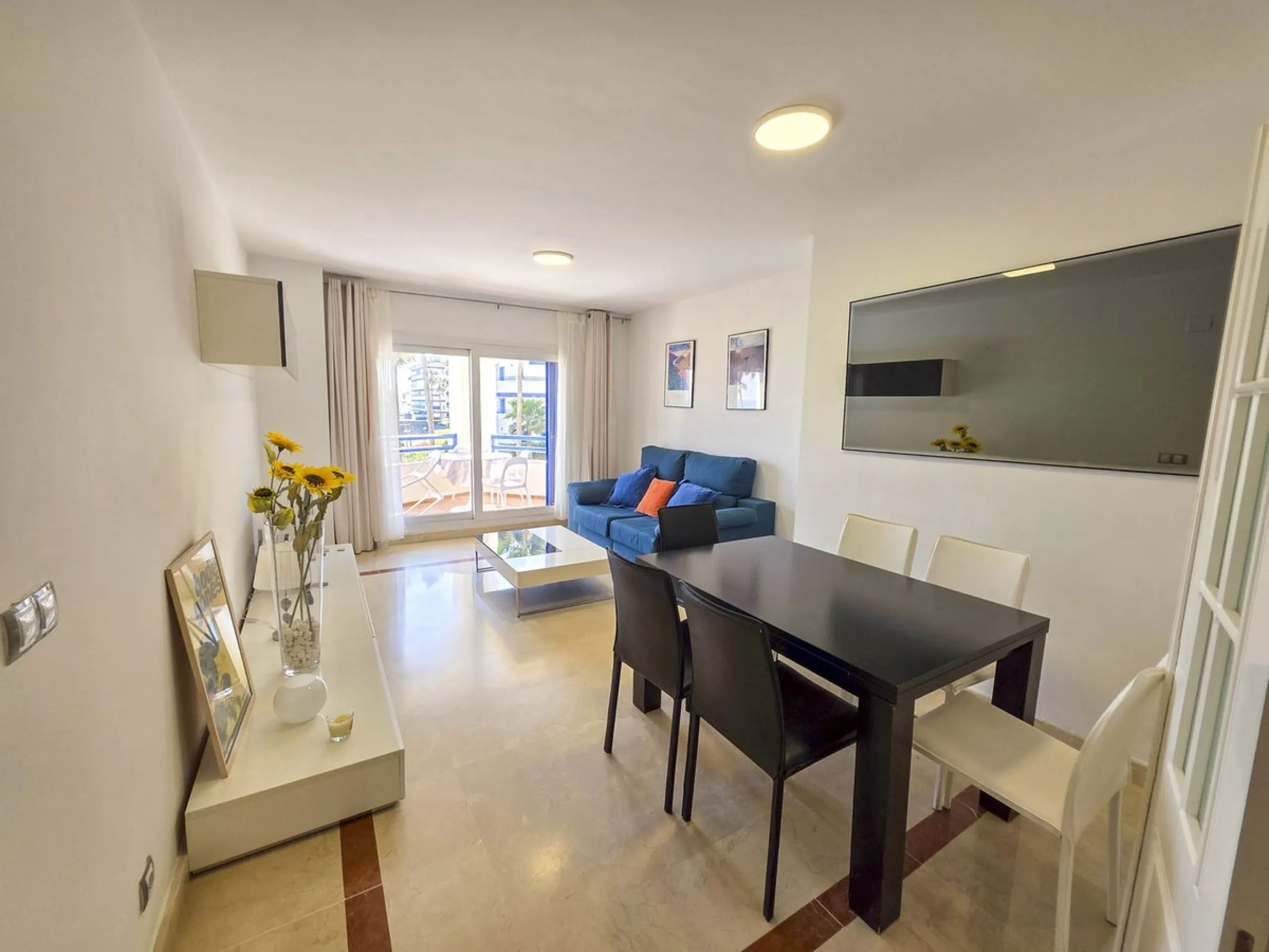 2-bedroom beachfront apartment with terrace, sea views, gardens, and pool, in the best urbanization of Sabinillas, in an unbeatable location within walking distance of all amenities.