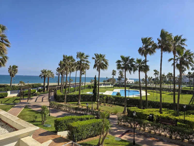 2-bedroom beachfront apartment with terrace, sea views, gardens, and pool, in the best urbanization of Sabinillas, in an unbeatable location within walking distance of all amenities.