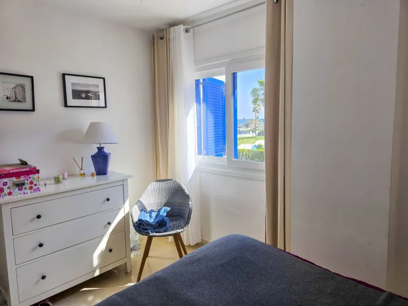 2-bedroom beachfront apartment with terrace, sea views, gardens, and pool, in the best urbanization of Sabinillas, in an unbeatable location within walking distance of all amenities.