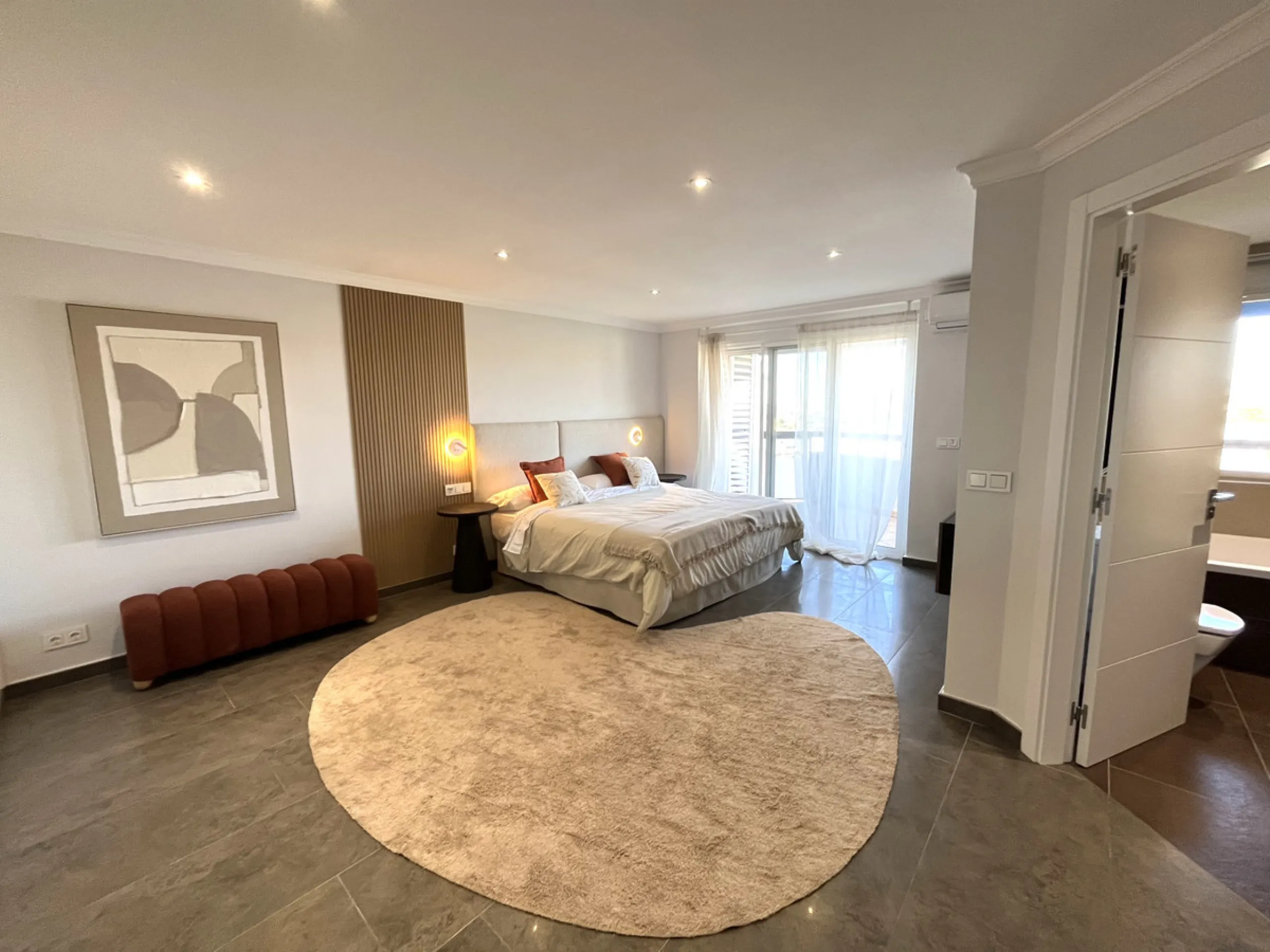 Experience the rare sense of space and openness in this beautifully renovated apartment, created by merging two separate units into one generous and well-designed home. This property offers panoramic views of the Mediterranean Sea and the surrounding moun