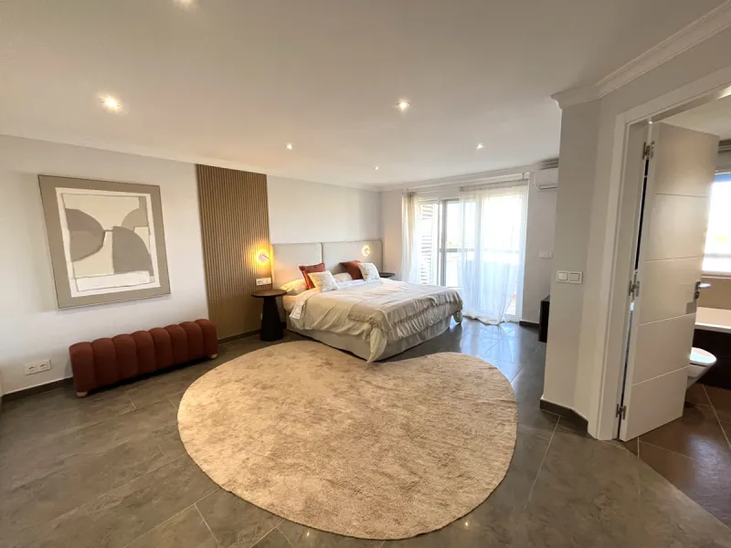 Experience the rare sense of space and openness in this beautifully renovated apartment, created by merging two separate units into one generous and well-designed home. This property offers panoramic views of the Mediterranean Sea and the surrounding moun
